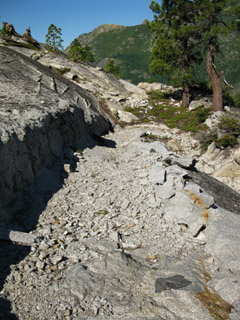 Granite trail cutout up Mount Reba